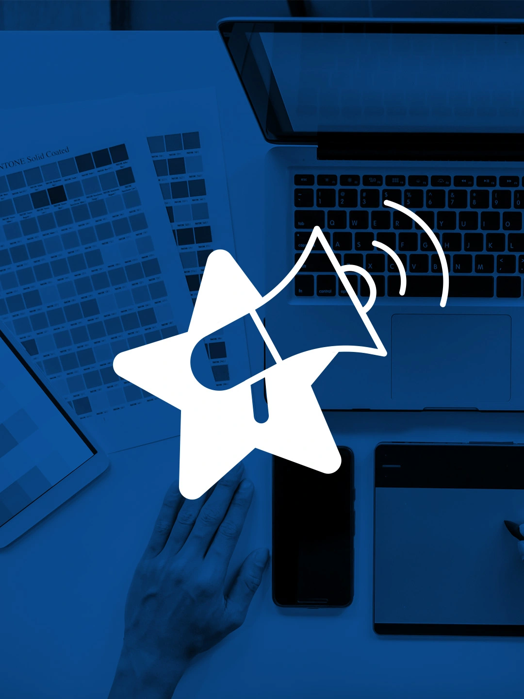 Megaphone over color palletes representing professional websites for businesses