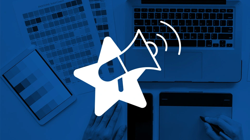 Megaphone over color palletes representing professional websites for businesses