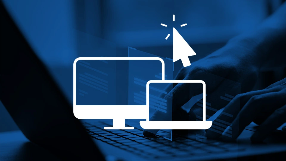 Laptop screens over a keyboard displaying development